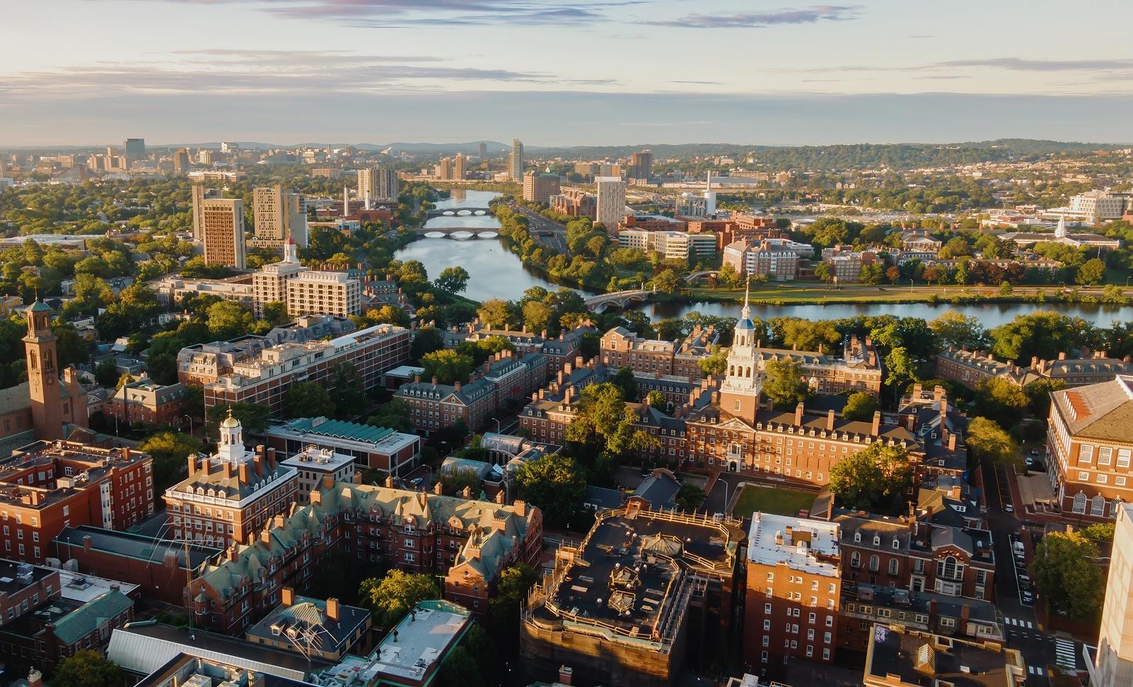 An aerial view of a university campus along a river
