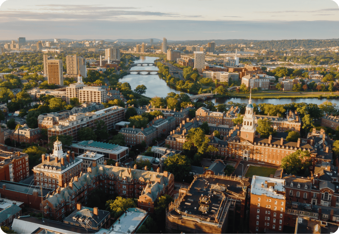 An aerial view of a university campus along a river