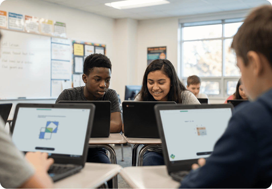 Students working on laptops in a classroom